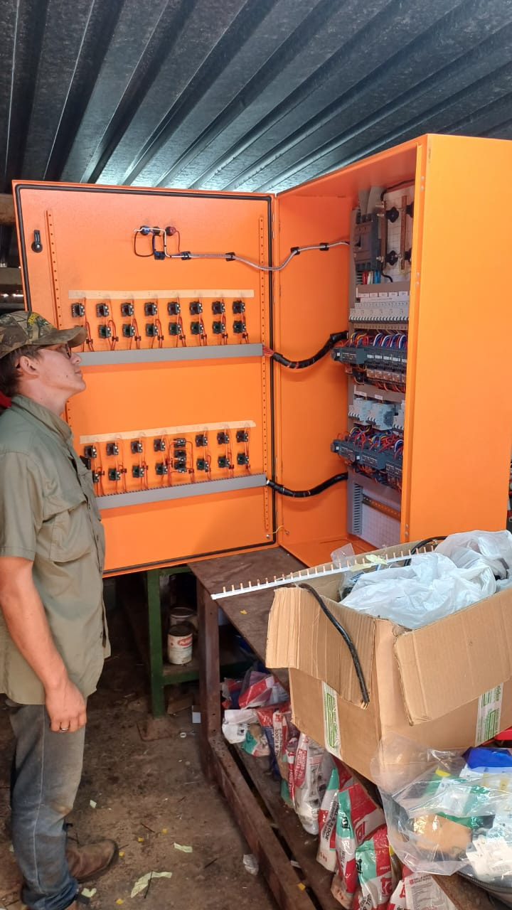Watt-Core technician inspecting an electrical control panel